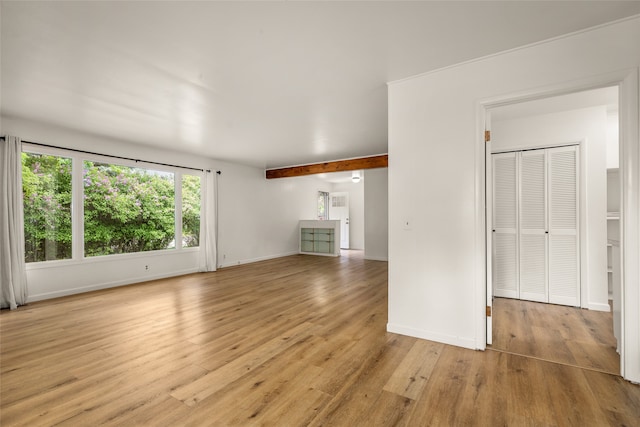 unfurnished living room with light wood-type flooring