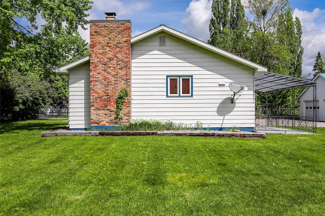 view of home's exterior with a garage and a lawn