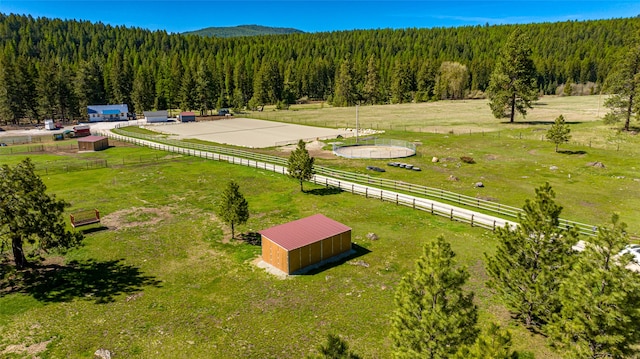 bird's eye view featuring a rural view and a forest view