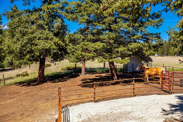 1200 Lost Creek Dr, Kalispell, MT 59901 - view of yard featuring an outdoor structure, an exterior structure, and a view of rural / pastoral area