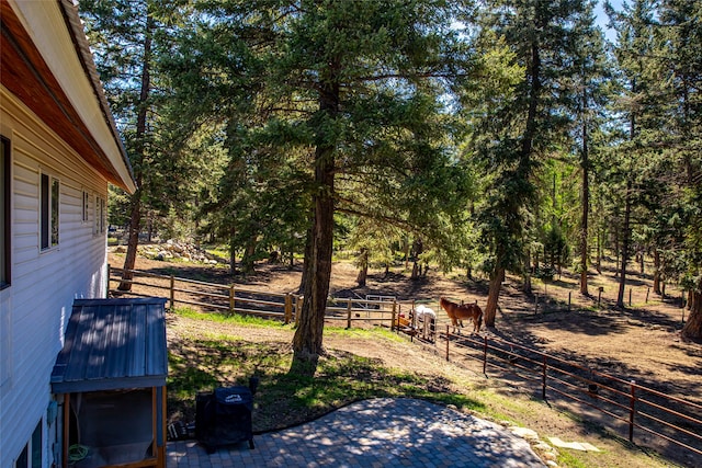 view of yard featuring fence and a patio