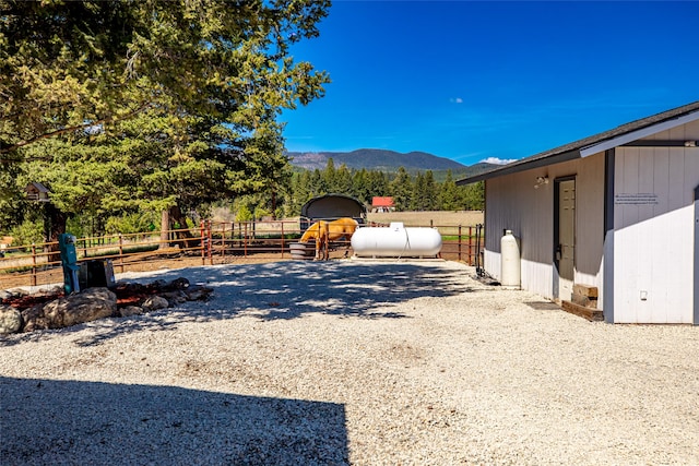 exterior space featuring an outbuilding and a mountain view