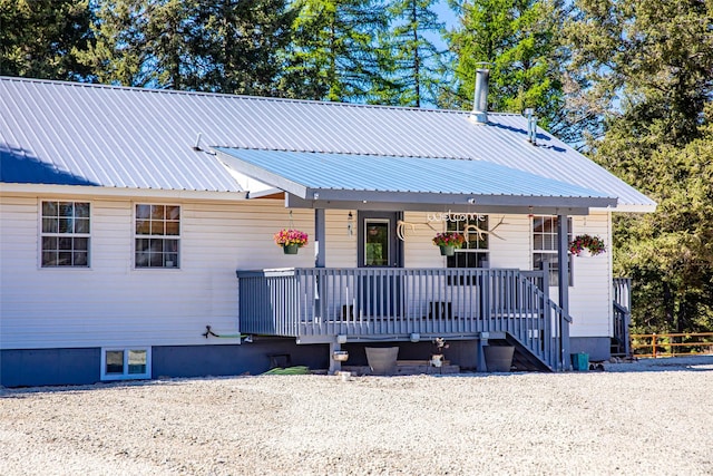 1200 Lost Creek Dr, Kalispell, MT 59901 - view of front of house with covered porch and a metal roof
