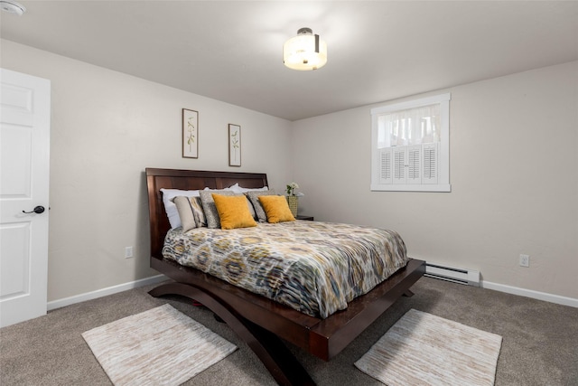 bedroom featuring a baseboard heating unit, carpet flooring, and baseboards