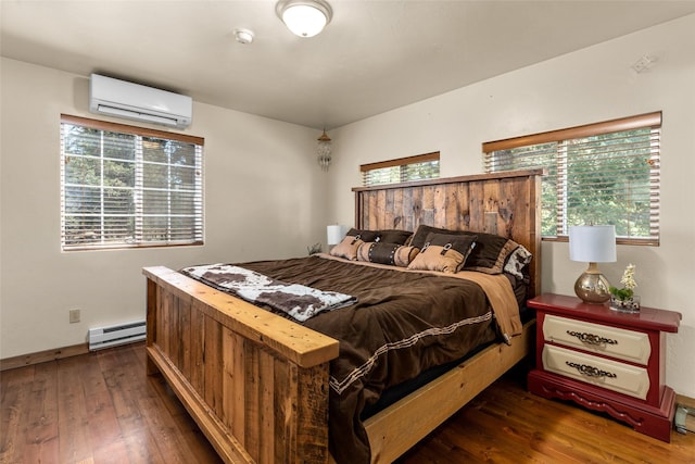 1200 Lost Creek Dr, Kalispell, MT 59901 - bedroom with a wall mounted air conditioner, baseboard heating, and hardwood / wood-style flooring