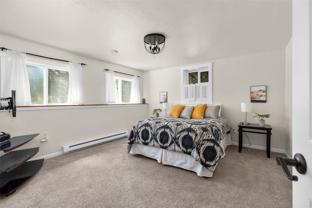 carpeted bedroom with a baseboard heating unit