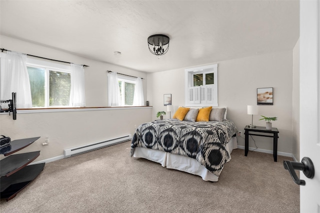 carpeted bedroom featuring a baseboard radiator and baseboards