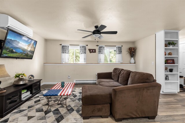 living room with hardwood / wood-style flooring, ceiling fan, an AC wall unit, and a baseboard radiator