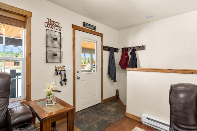 1200 Lost Creek Dr, Kalispell, MT 59901 - foyer with baseboard heating and dark stone finish floors