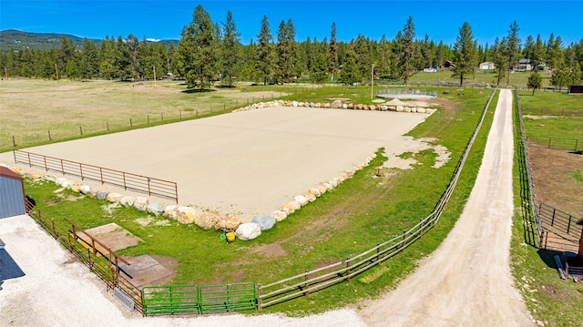 birds eye view of property with a rural view