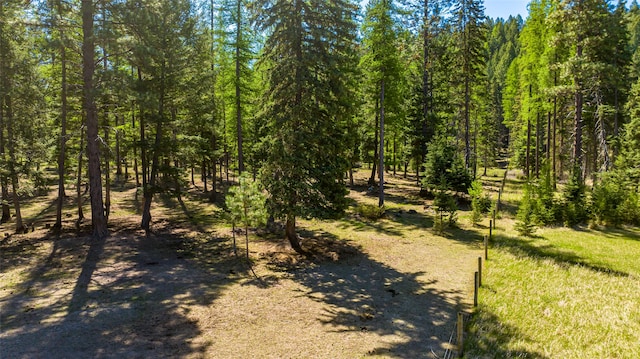 view of landscape featuring a wooded view