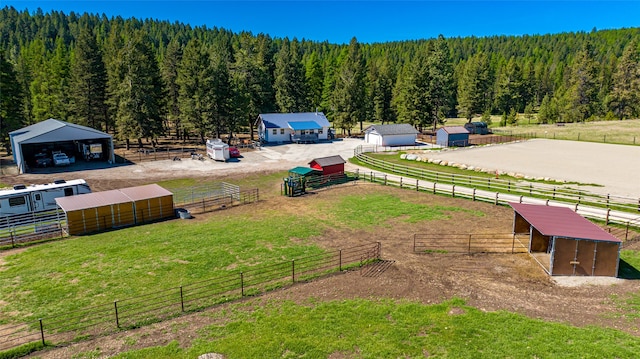 drone / aerial view with a rural view and a view of trees