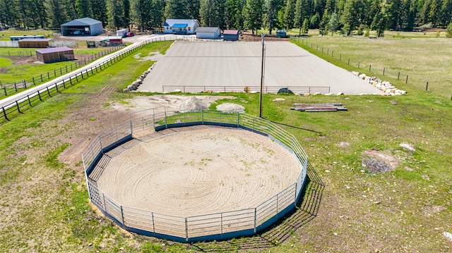 birds eye view of property with a rural view