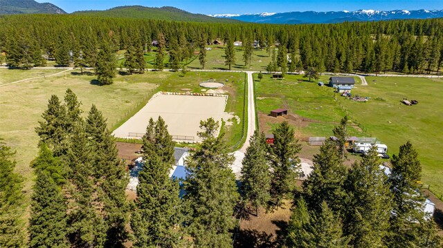 1200 Lost Creek Dr, Kalispell, MT 59901 - drone / aerial view of a mountain backdrop and a forest