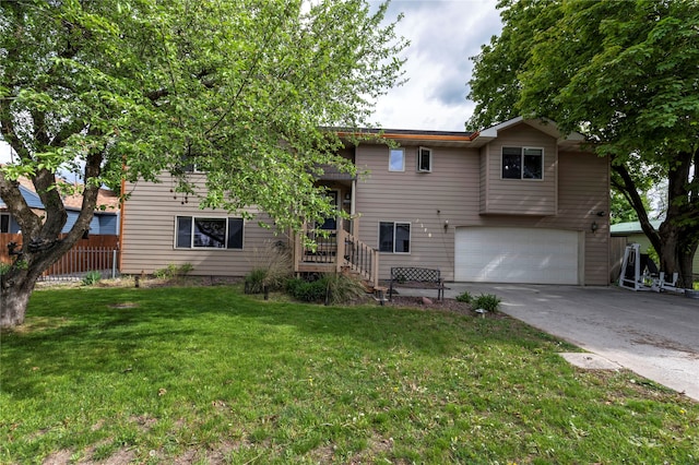 view of front of house featuring a front yard and a garage