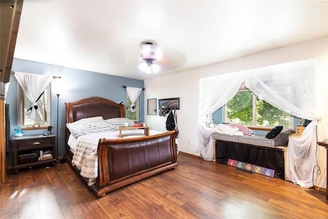 bedroom featuring ceiling fan and hardwood / wood-style flooring