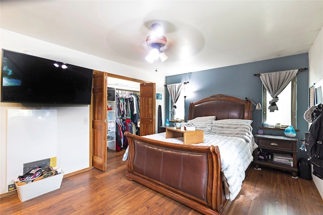 bedroom featuring a closet, wood-type flooring, and ceiling fan