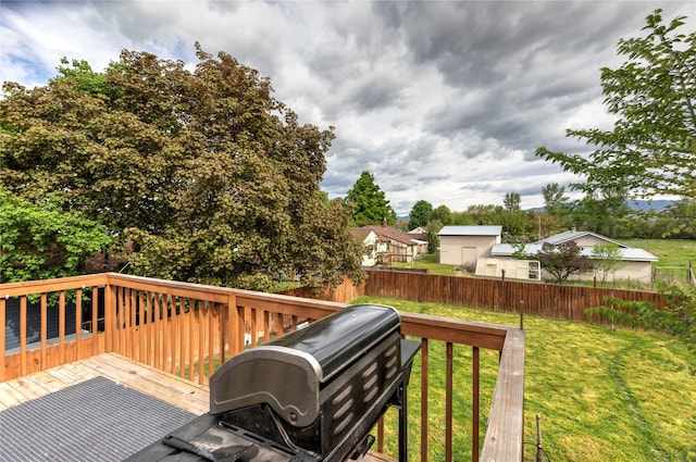 wooden deck with a yard