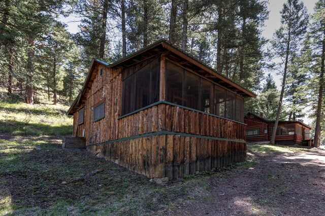 283 Lost Trail Hot Springs Rd, Sula, MT 59871 - view of side of home with a sunroom