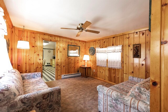 283 Lost Trail Hot Springs Rd, Sula, MT 59871 - carpeted living room with ornamental molding, baseboard heating, wooden walls, and ceiling fan