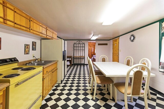 283 Lost Trail Hot Springs Rd, Sula, MT 59871 - kitchen featuring sink, white appliances, and light tile floors