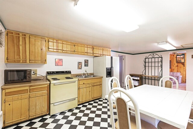 283 Lost Trail Hot Springs Rd, Sula, MT 59871 - kitchen with white appliances, sink, and light tile flooring