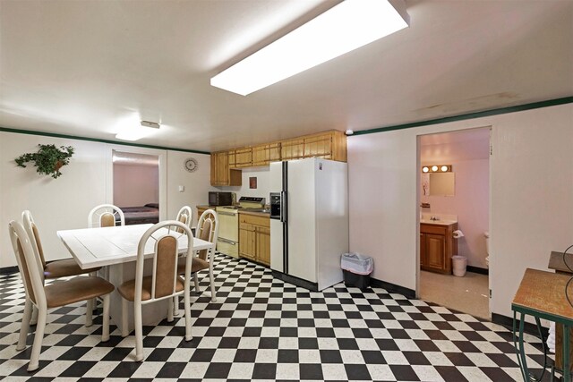 283 Lost Trail Hot Springs Rd, Sula, MT 59871 - kitchen with white appliances and light tile floors