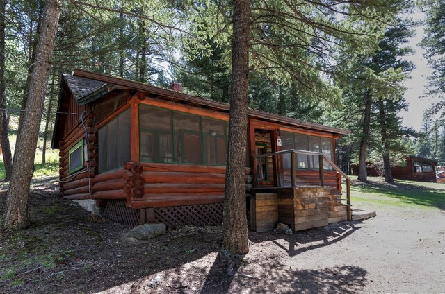 283 Lost Trail Hot Springs Rd, Sula, MT 59871 - rear view of property with a sunroom