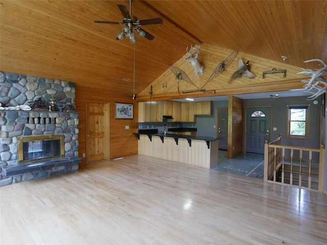 41698 Canal Rd, Polson, MT 59860 - unfurnished living room featuring high vaulted ceiling, wood ceiling, wood finished floors, a ceiling fan, and a sink