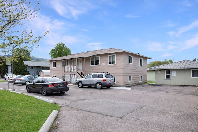 exterior space featuring a front lawn