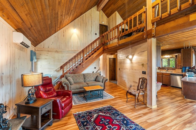 living room with light hardwood / wood-style floors, high vaulted ceiling, wood walls, and a wall mounted air conditioner