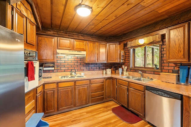 kitchen featuring stainless steel appliances, wooden ceiling, sink, and light hardwood / wood-style flooring