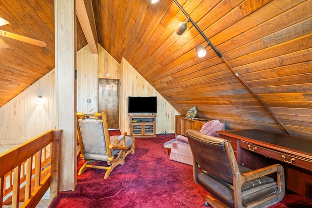 carpeted office with wooden ceiling, wooden walls, vaulted ceiling with beams, and ceiling fan