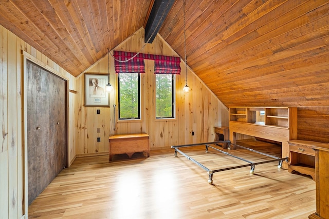 unfurnished bedroom with wood ceiling, wood walls, light wood-type flooring, and vaulted ceiling