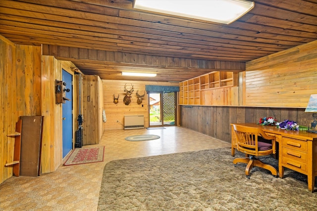 home office with wooden ceiling and wooden walls