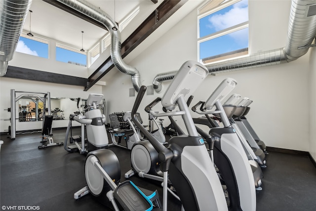 gym featuring a high ceiling