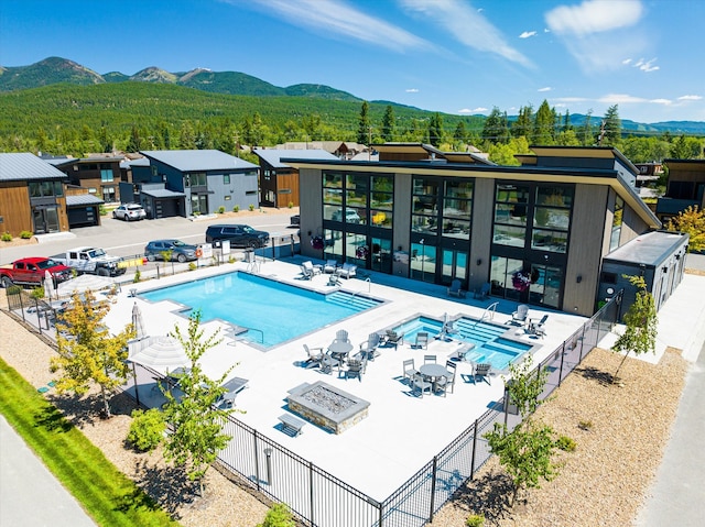 view of pool featuring a patio and a mountain view