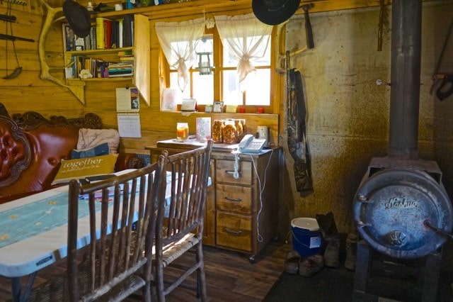 interior space featuring a wood stove and hardwood / wood-style floors