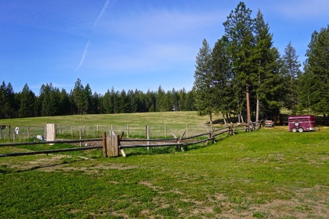 view of yard with a rural view