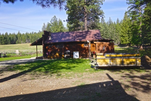 view of outdoor structure with a rural view