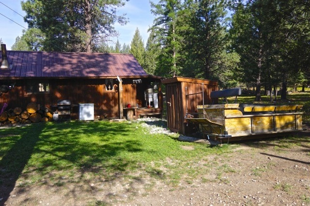 rear view of house featuring a lawn