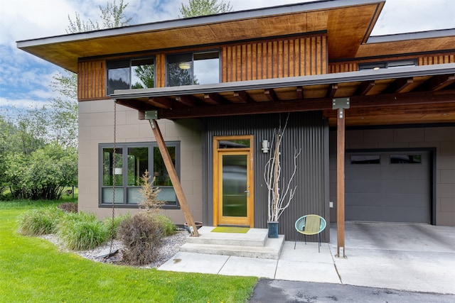 view of exterior entry featuring a garage