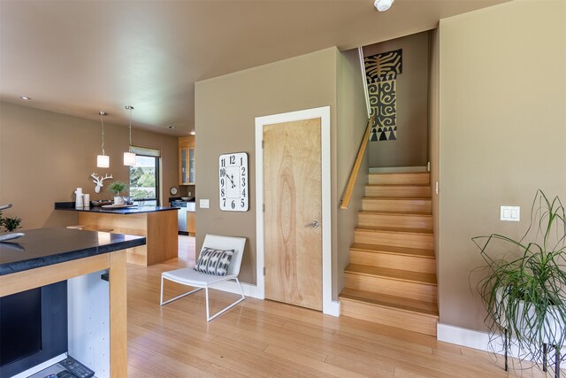 staircase featuring light hardwood / wood-style floors