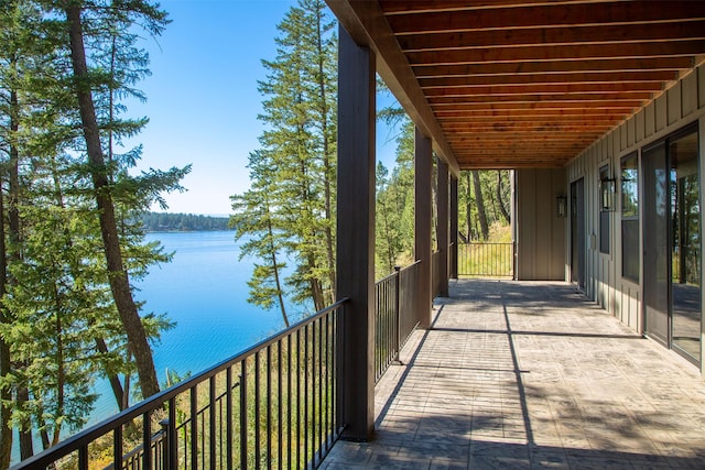 198 Blaine Lakeshore Dr, Kalispell, MT 59901 - view of patio / terrace with a water view and a balcony