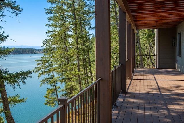 198 Blaine Lakeshore Dr, Kalispell, MT 59901 - wooden terrace featuring a water view