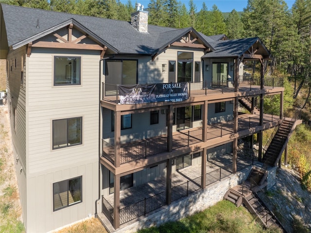 rear view of house featuring a deck