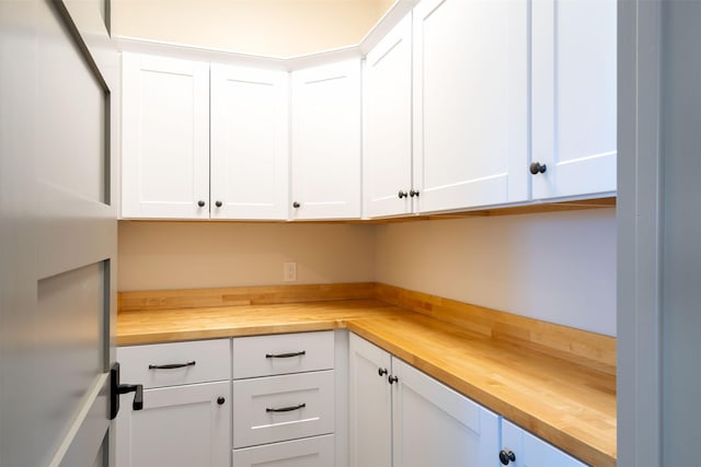 198 Blaine Lakeshore Dr, Kalispell, MT 59901 - kitchen with white cabinetry and butcher block counters