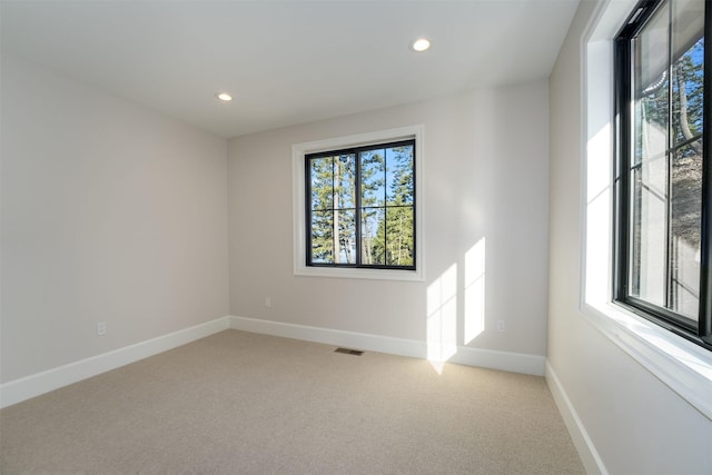 198 Blaine Lakeshore Dr, Kalispell, MT 59901 - unfurnished room featuring light carpet, recessed lighting, visible vents, and baseboards