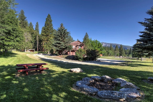 exterior space with a deck with mountain view