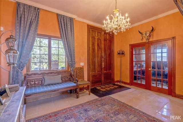 interior space featuring an inviting chandelier, ornamental molding, light tile patterned flooring, and french doors